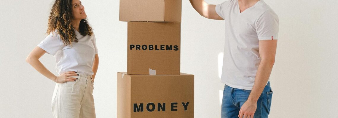 Man and Woman Standing Near Boxes with Labels